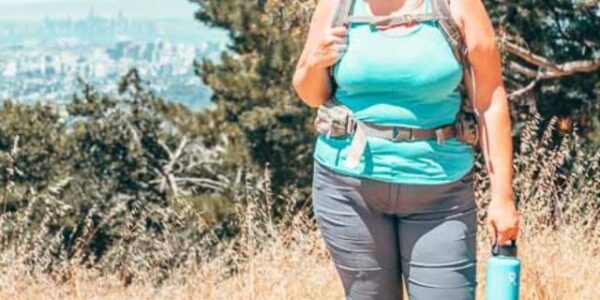 Lia in the prAna Halle pant hiking and wearing a backpack.