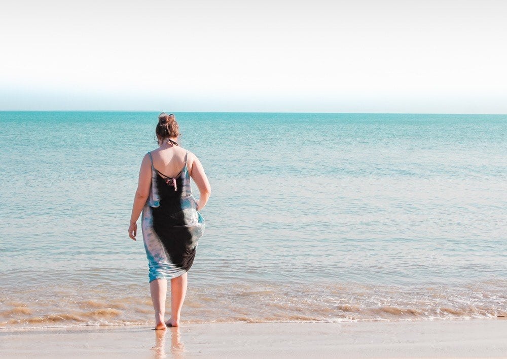 Lia dipping her toes in the ocean at Playa Manglares, Isla Baru, Cartagena, Colombia.