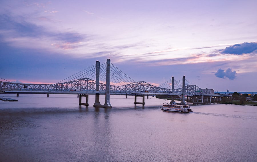 Sunset over the Ohio River and bridges in Louisville as the Belle of Louisville returns home.