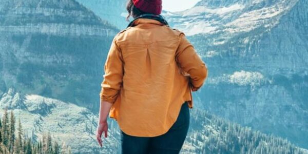 Exploring Glacier National Park in Allbirds white sneakers.