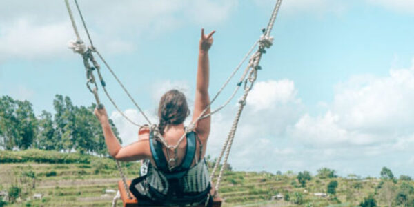 Swinging above the rice terraces in Bali, Indonesia.