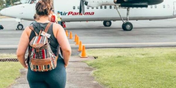 Lia walking up to an Air Panama plane.