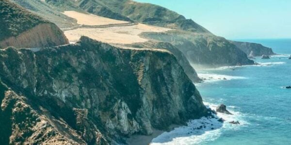 Cliffs descending into the ocean along the California Coast on the Pacific Coast Highway.