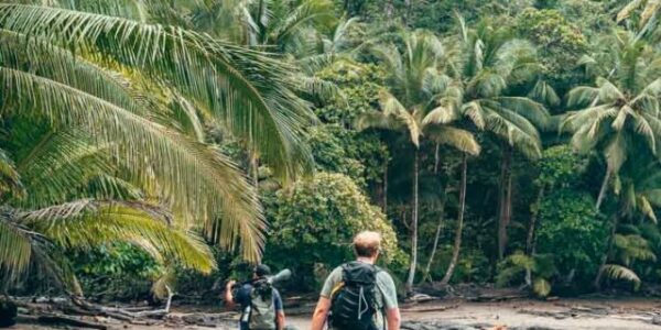 Jeremy and guide hiking on the beach in Corcovado National Park, Costa Rica