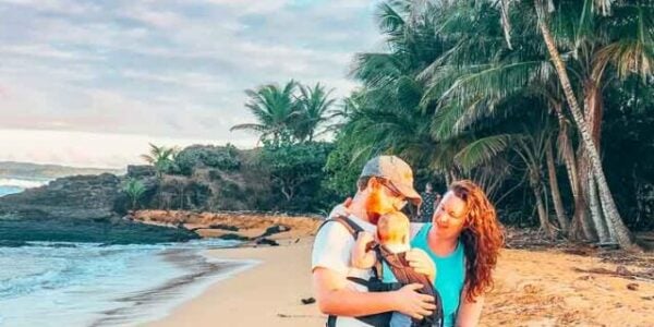 Couple and baby on the beach in Puerto Rico